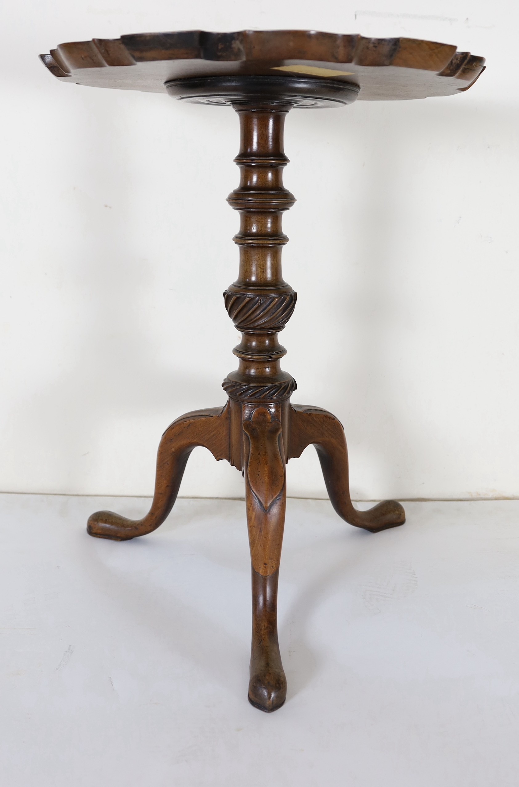 A George III circular mahogany piecrust tripod wine table, diameter 46cm, height 60cm